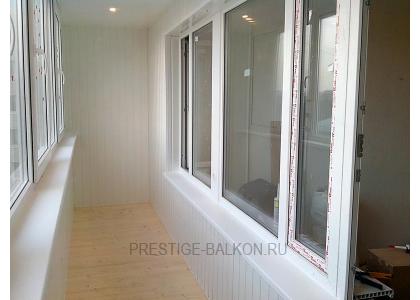 Теплое остекление балкона профилем rehau с утеплением и деревянной отделкой в Малаховке