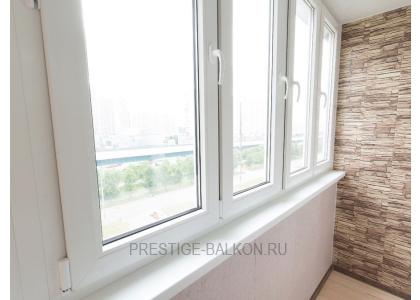 Тёплое остекление балкона профилем КВЕ и комбинированной отделкой пластиком и деревом в Малаховке