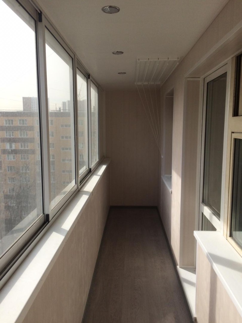 Теплое остекление балкона профилем KBE и установка сушилки в Малаховке